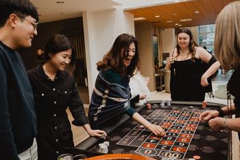 a group of people playing a game at a table
